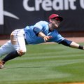 Brian Fletcher, Northwest Arkansas Naturals left fielder, dives for a fly ball during Wednesday’s ga...