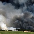 Large plumes of smoke rise from a wild land fire in the Black Forest northeast of Colorado Springs, ...