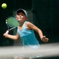 Caroline Long, 10, of Rogers returns a shot on while playing Sarah Schneringer, 11, of Fayetteville ...