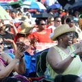 Mary Greene, left, and Eva Boddie enjoy the music of the Arkansas Gospel Mass Choir on Friday at Orc...