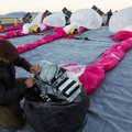In this June 10, 2013 photo released by Google, Jordan Miceli prepares electronics to launch balloon...