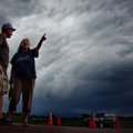 Jasen Dill, left, and Judy Pohlod discuss returning to their homes, which made it through the Black ...