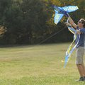 Andy Heinzelmann of Fayetteville untangles the tail of a kite shaped like a U.S. Navy Blue Angels ai...