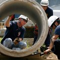 Springdale Fire Capt. Tom Pearson, from left, Rogers firefighters Tyler Steele and Nathan Meeks work...