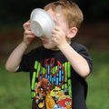 Samuel Cordell, 4, of Fayetteville eats ice cream Saturday during the annual Washington County Histo...