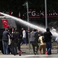 Turkish riot police spray water cannon at demonstrators who remained defiant after authorities evict...