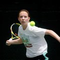 Mallory Tabler, 16, of Bentonville returns a shot Sunday during her match against Haeleigh Long, 15,...