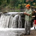 John Hassion and his son, Graham Hassion, 12, both of Bella Vista try their luck under the bridge on...