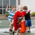 Grayson Davis, from left, 5, Joseph Johnson, 5, and Tristen Nix, 3, play with water-soaked sponges M...