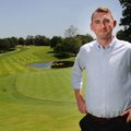 Harry Hardy, tournament director for the Walmart NW Arkansas Championship, stands on the 18th green ...