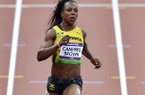 File- This Aug. 3, 2012 file photo shows Jamaica's Veronica Campbell-Brown competing in a women's 100-meter heat during the athletics in the Olympic Stadium at the 2012 Summer Olympics, London. Campbell-Brown, or "VCB" as she's simply known in sprinting circles, tested positive for a banned diuretic at a meet in May and will serve a suspension while anti-doping officials rule on the positive drug test, island track officials announced Tuesday June 18, 2013. (AP Photo/Martin Meissner, File)