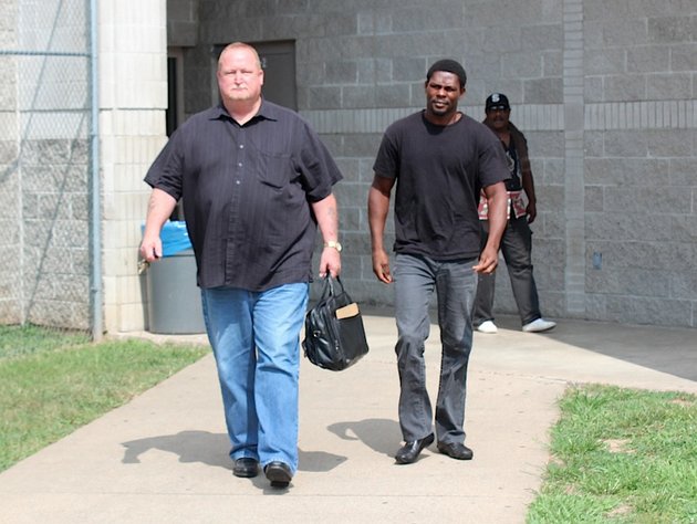 former-professional-boxing-champion-jermain-taylor-center-leaves-the-pulaski-county-jail-wednesday-morning-with-his-bail-bondsman-left-taylors-bail-had-been-set-at-25000-after-he-was-charged-with-first-degree-domestic-battery-and-aggravated-assault-in-the-tuesday-shooting-of-his-cousin