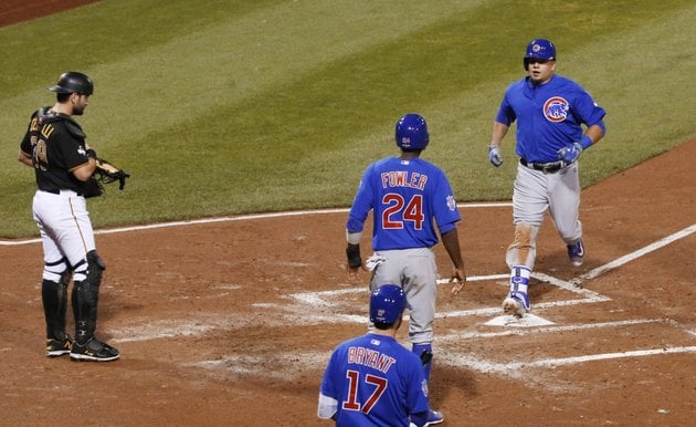 chicago-cubs-kyle-schwarber-right-steps-on-home-plate-after-he-drove-dexter-fowler-24-in-with-a-two-run-home-run-in-the-third-inning-of-the-national-league-wild-card-baseball-game-against-the-pittsburgh-pirates-wednesday-oct-7-2015-in-pittsburgh-pittsburgh-pirates-catcher-francisco-cervelli-is-at-left-ap-photogene-j-puskar