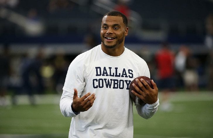 Dallas Cowboys quarterback Dak Prescott smiles during warm ...