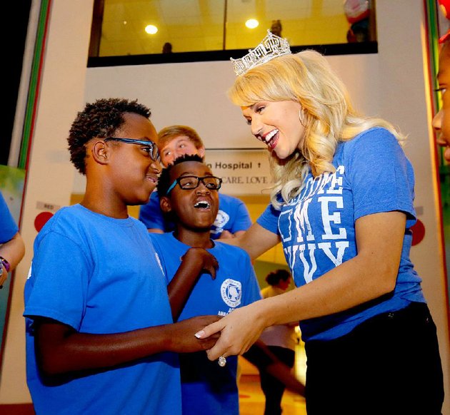 miss-america-savvy-shields-visits-with-trent-hollon-left-and-his-twin-brother-trey-both-11-at-an-event-friday-at-arkansas-childrens-hospital-in-little-rock-shields-21-of-fayetteville-returned-thursday-to-her-home-state-with-a-parade-in-little-rock-a-second-homecoming-parade-is-planned-for-her-today-in-fayetteville