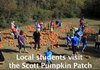 Students from various schools in central Arkansas visit the Scott Pumpkin Patch in North Little Rock Wednesday morning to pick out pumpkins, pet animals and watch the pig races.