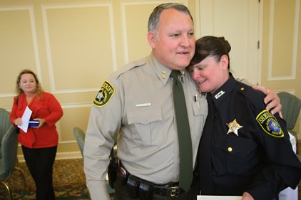 Pulaski County Sheriff Doc Holladay congratulates detention officer ...