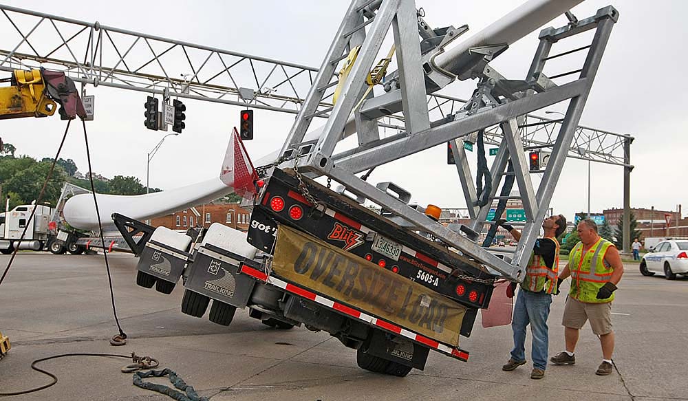 Towing crews work to clear an accident involving a truck ...