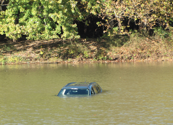 Empty SUV partly submerged off Murray Park boat ramp