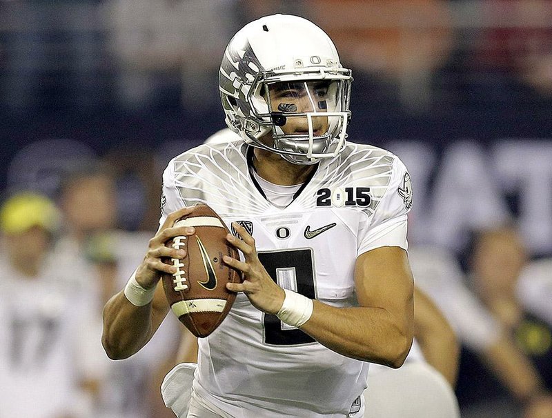 Watch: Marcus Mariota falls down, gets up and completes a pass