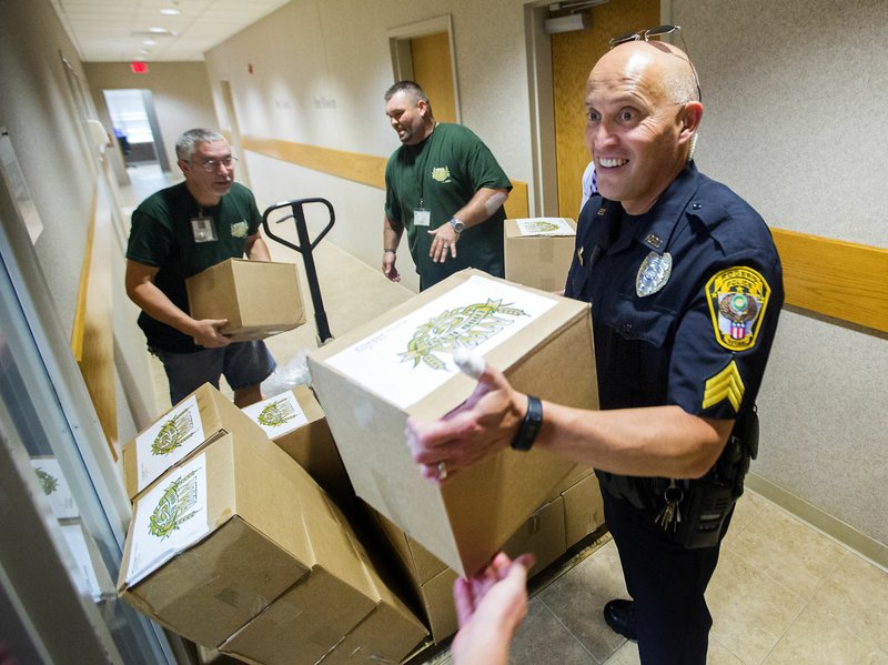 Rogers Police And Food Bank Partner To Deliver Food