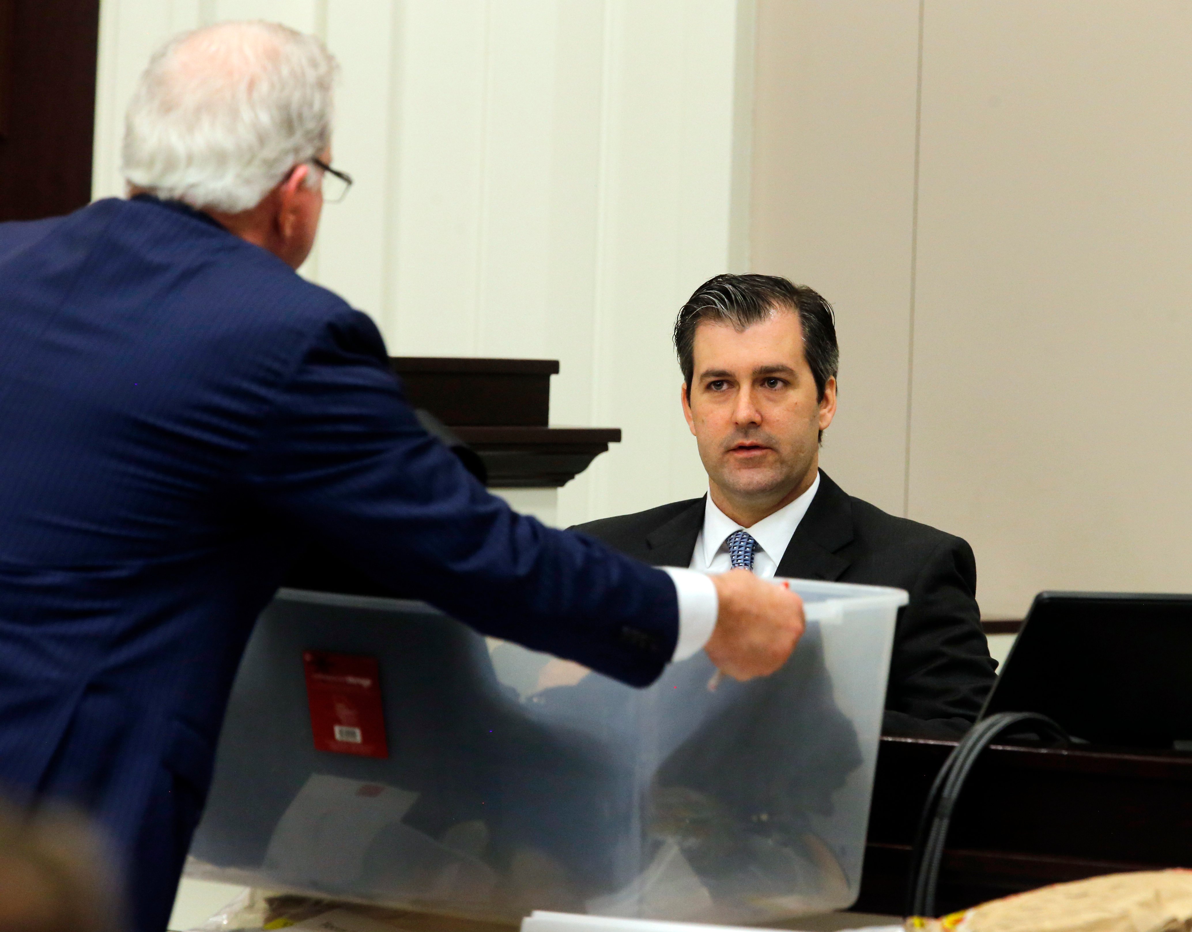 Defense attorney Andy Savage, left, shows items to former North ...