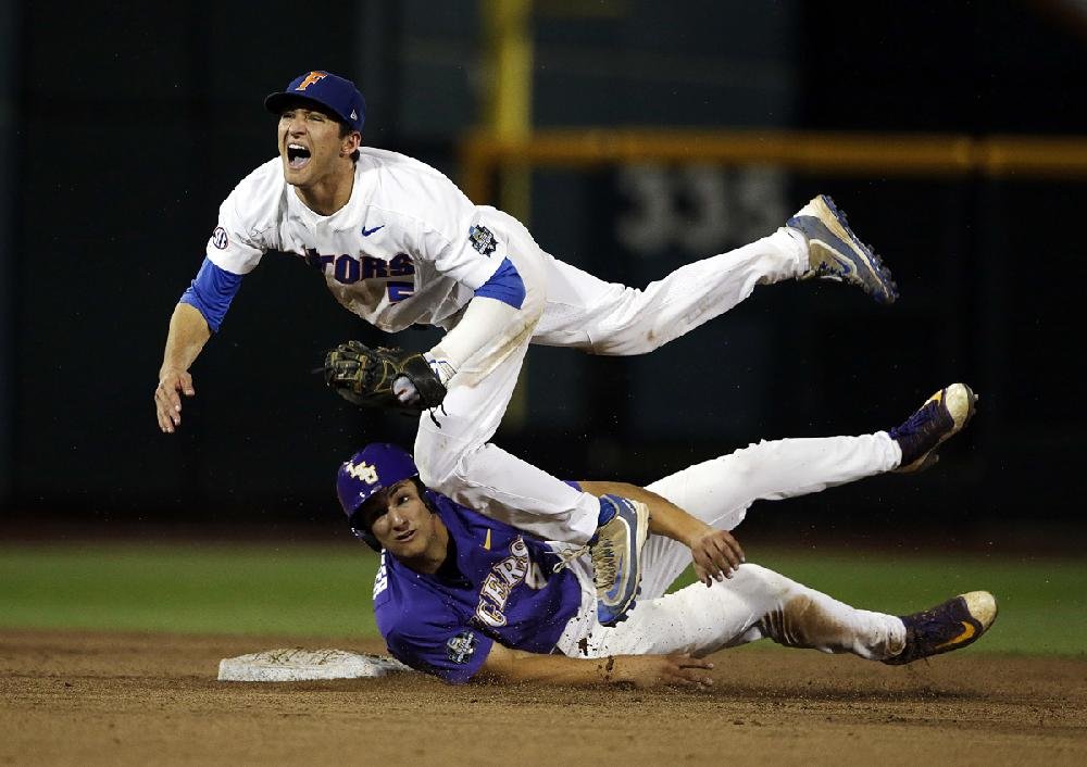 COLLEGE WORLD SERIES: Singer's 12 Ks help Gators beat LSU 4-3 in