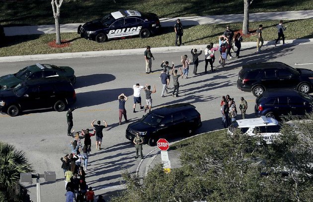 police-lead-students-away-from-marjory-stoneman-douglas-high-school-on-feb-14-after-a-gunman-opened-fire-inside-and-an-on-duty-deputy-failed-to-act-in-arkansas-law-enforcement-departments-say-they-teach-their-officers-that-in-such-cases-the-first-officer-on-the-scene-should-immediately-enter-the-building-and-confront-the-gunman