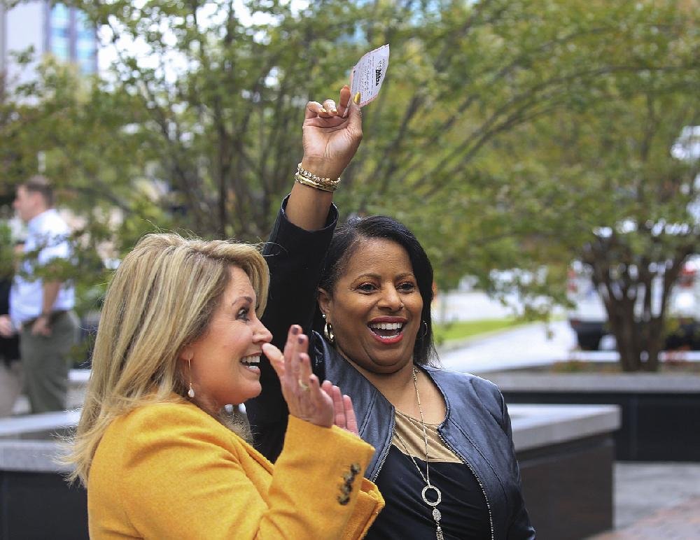 No Mega Millions Winner Jackpot Climbs To 1 6 Billion - donna bragg left with the arkansas scholarship lottery gives crystal barker of north little rock a mega millions ticket friday afternoon in downtown