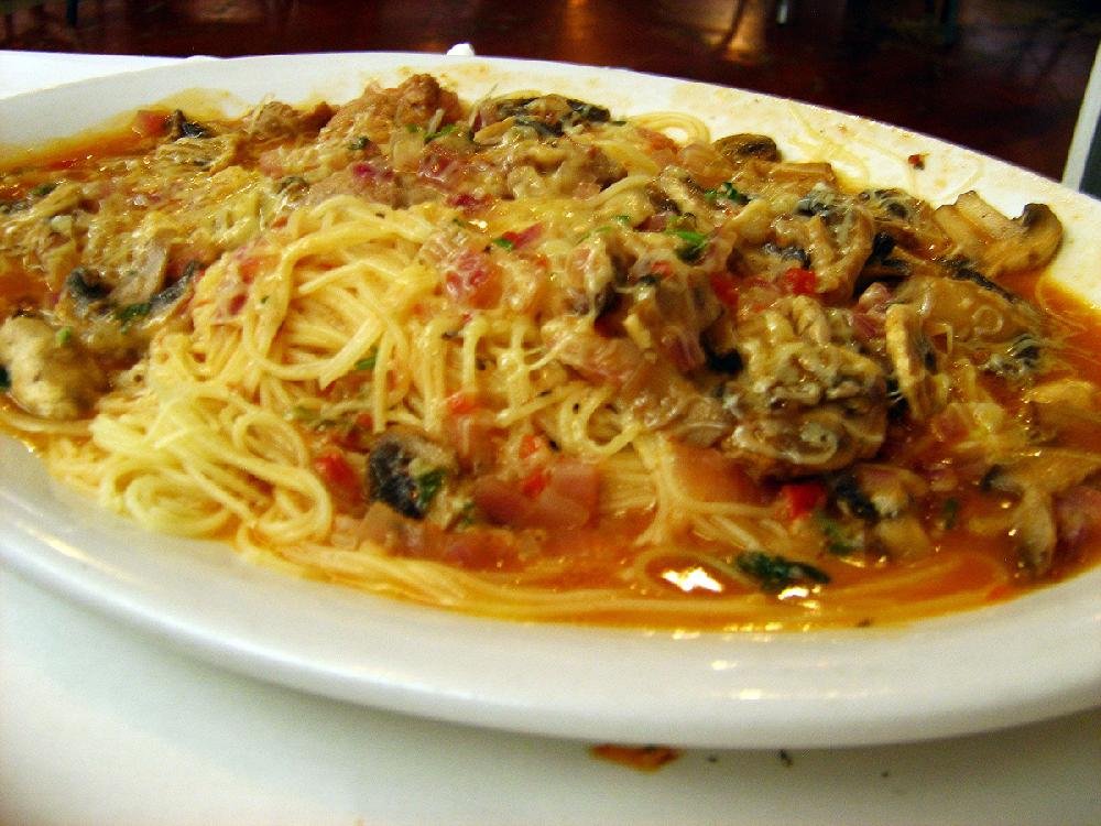 The Veal Marsala at Roma Italian Restaurant in Jacksonville is made with sauteed shallots and mushrooms in a Marsala wine sauce served over spaghettini pasta. 