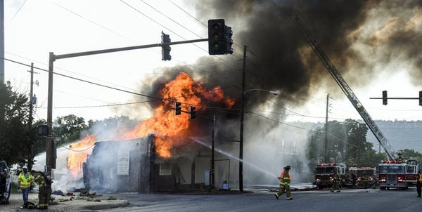 Fire closes roadway, causes power outage