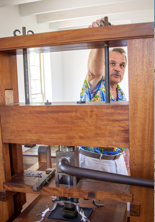 Historic Arkansas Museum object conservator Andy Zawacki with the replica of newspaper publisher William Woodruff's Ramage press. Zawacki is retiring after 38 years with the museum. (Arkansas Democrat-Gazette/CARY JENKINS) 