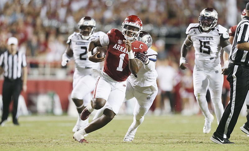 Arkansas quarterback KJ Jefferson wears bowl championship rings