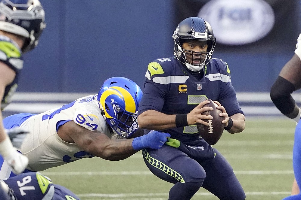 Los Angeles Rams outside linebacker Leonard Floyd (54) knocks the ball away  as Seattle Seahawks …